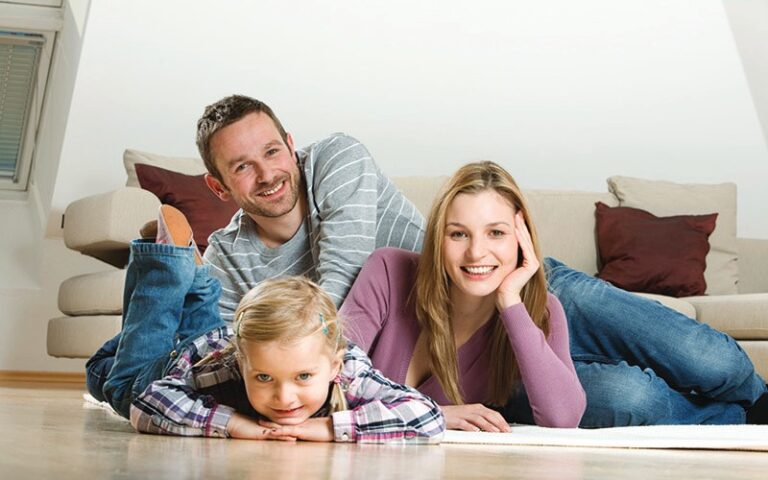 happy family lying on floor