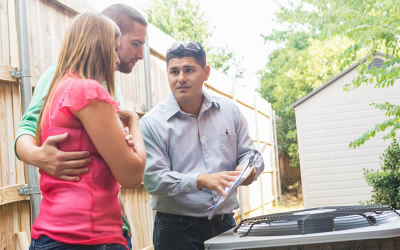 homeowners talking to contractor