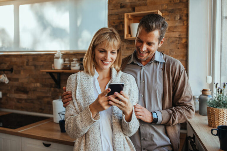 couple looking at smartphone